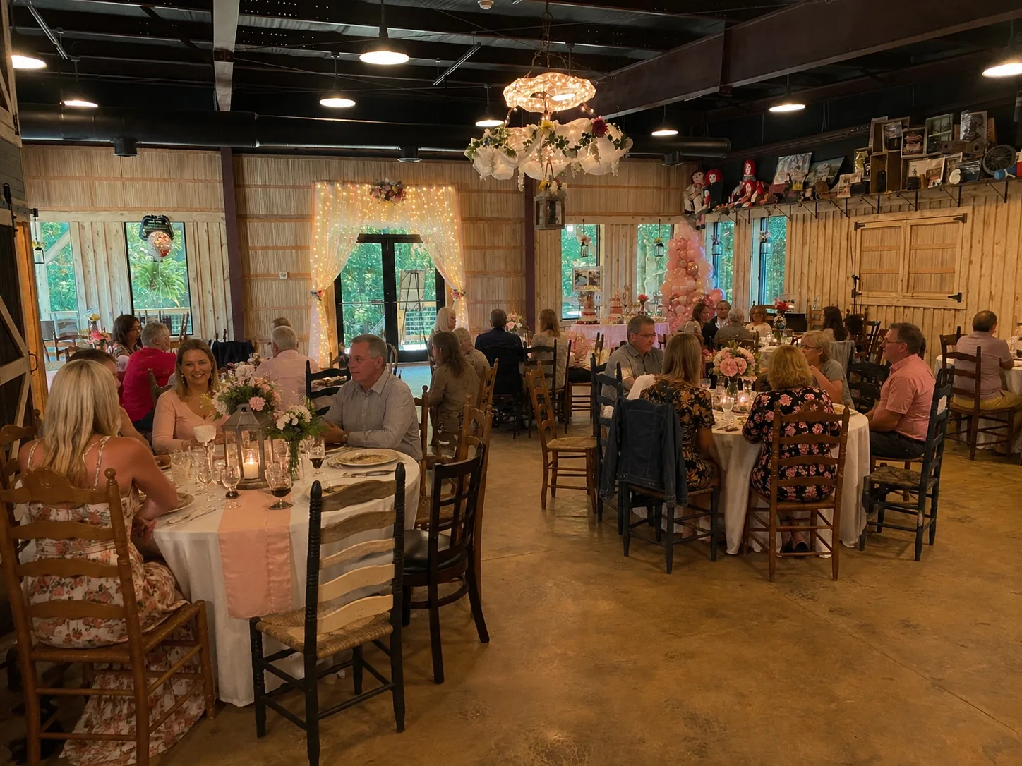Guests dining together at a celebration inside The Shed at Papa's Creek
