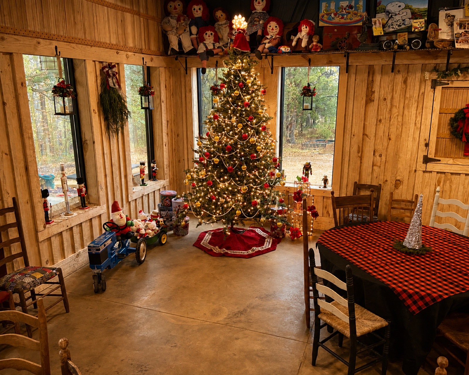 The Shed decorated for Christmas with a tall tree and holiday tables