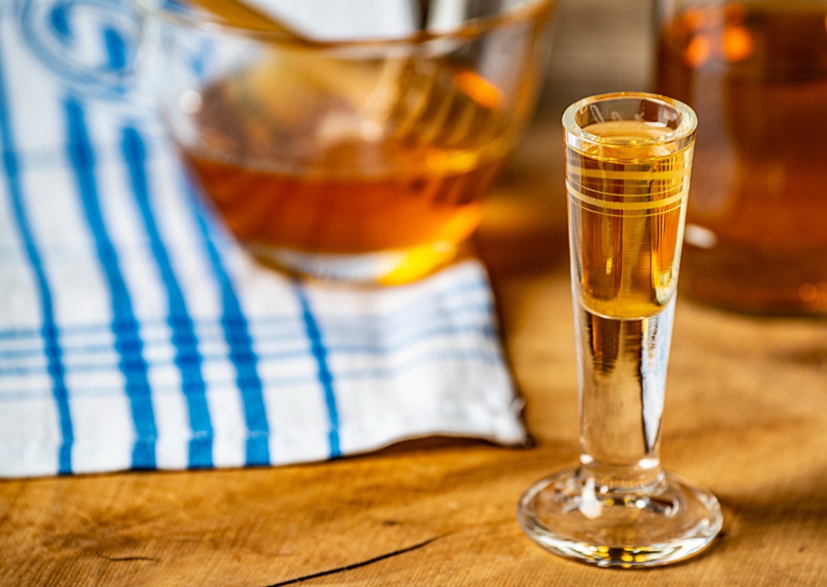 Glasses of honey wine on a wooden table