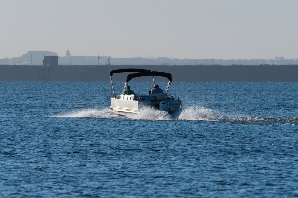 A pontoon boat heading out on Lake Hartwell