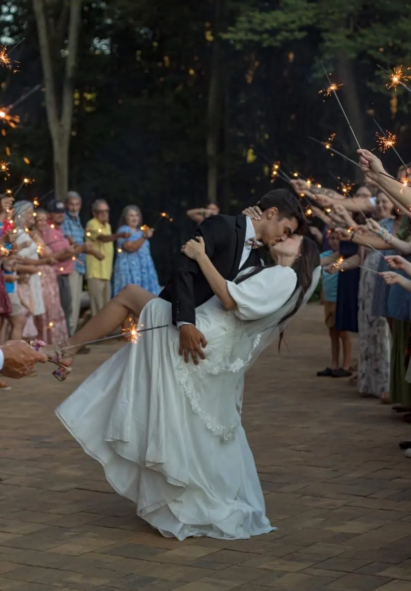 Bride and groom sparkler dip kiss at The Shed at Papa's Creek wedding venue, Lavonia Georgia