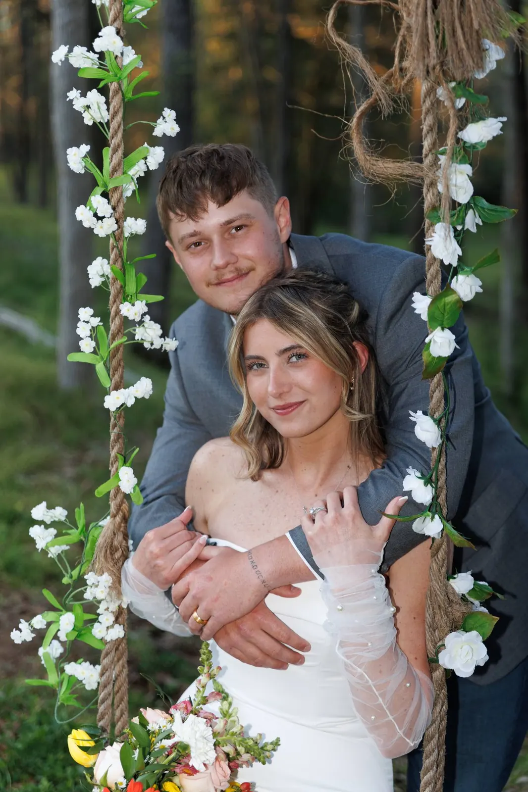 Bride and groom portrait on the rope swing at The Shed at Papa's Creek, Lavonia Georgia