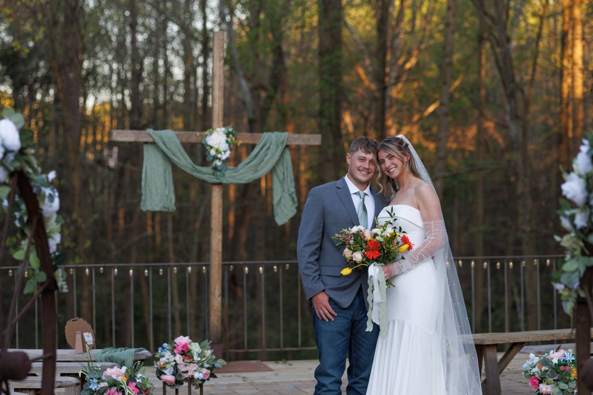 Newly married couple in their finished terrace ceremony setting at The Shed at Papa's Creek in Lavonia, Georgia