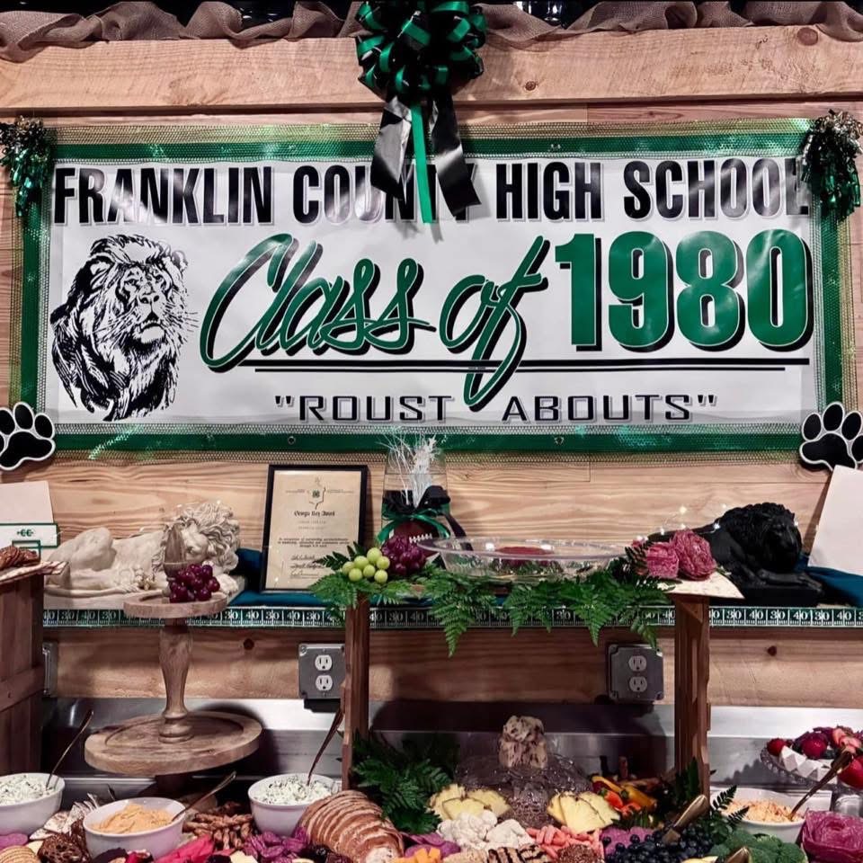 Class reunion buffet and personalized decorations inside The Shed