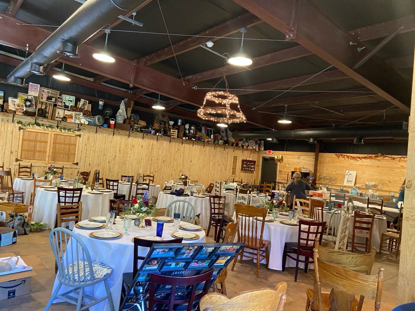 The reclaimed wood walls, barbed-wire chandelier, and antiques inside The Shed at Papa's Creek