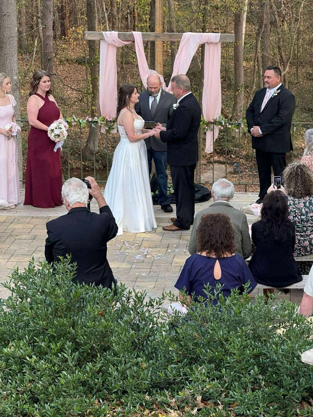 Bride and groom exchanging vows on the stone ceremony terrace